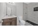 Updated bathroom featuring stylish vanity, sleek sink fixtures, and a luxurious walk-in shower with unique tiling at 815 Oxford Hall Dr, Lawrenceville, GA 30044