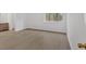 Large bedroom space with wood-look flooring featuring an ensuite bathroom and walk-in closet at 815 Oxford Hall Dr, Lawrenceville, GA 30044