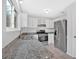 Well-lit kitchen featuring granite countertops, stainless steel appliances, and lots of counter space at 815 Oxford Hall Dr, Lawrenceville, GA 30044