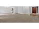 Spacious living area with wood-look flooring leading to an eat-in kitchen and a welcoming front entrance at 815 Oxford Hall Dr, Lawrenceville, GA 30044