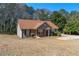 Cozy single-story home with a front porch, manicured shrubs, and a well-kept lawn at 131 Tye St, Stockbridge, GA 30281