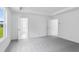 Bright bedroom featuring two windows offering natural light and spacious layout at 1744 Fawlocke Run, Loganville, GA 30052