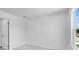 Clean, empty bedroom with soft carpet, a window, and fresh white paint at 1744 Fawlocke Run, Loganville, GA 30052