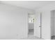 Neutral bedroom showing the doorway and soft carpet, and fresh white paint at 1744 Fawlocke Run, Loganville, GA 30052