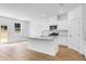 Beautiful open kitchen features granite counters, stainless appliances, and large island at 1744 Fawlocke Run, Loganville, GA 30052