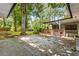 A concrete patio with a covered outdoor seating area to enjoy your green backyard at 3113 Bellgreen Way, Decatur, GA 30032