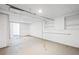 Unfinished basement with painted walls, lighting, and access to the exterior at 3113 Bellgreen Way, Decatur, GA 30032