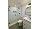 Modern bathroom featuring a glass shower with patterned tile and a white vanity at 3113 Bellgreen Way, Decatur, GA 30032