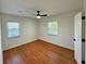 Cozy bedroom with hardwood floors, ceiling fan, and bright natural light at 3113 Bellgreen Way, Decatur, GA 30032