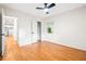 Empty bedroom featuring hardwood floors, closet, and a window at 3113 Bellgreen Way, Decatur, GA 30032
