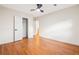 Empty bedroom featuring hardwood floors, closet, and a window at 3113 Bellgreen Way, Decatur, GA 30032