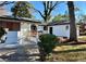 Charming single-story home with a well-maintained lawn, inviting entryway and modern accents at 3113 Bellgreen Way, Decatur, GA 30032