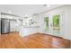 Bright kitchen with stainless steel appliances, white cabinets, an island, and doors leading to the backyard at 3113 Bellgreen Way, Decatur, GA 30032