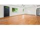 Bright living room with hardwood floors, fresh paint, a ceiling fan, and windows offering natural light at 3113 Bellgreen Way, Decatur, GA 30032