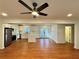 Open-concept living space with hardwood floors and a view of the kitchen at 3113 Bellgreen Way, Decatur, GA 30032