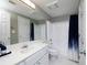 Bright bathroom featuring modern fixtures, a shower with tub and a large mirror above the vanity at 3481 Lakeside Ne Dr # 1705, Atlanta, GA 30326