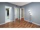 Spacious bedroom featuring hardwood floors, closet space and a modern light to make the room complete at 3481 Lakeside Ne Dr # 1705, Atlanta, GA 30326
