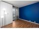 Cozy bedroom with lots of natural light and a blue accent wall, with a large white closet space at 3481 Lakeside Ne Dr # 1705, Atlanta, GA 30326