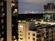 A stunning city skyline at night with lights, as viewed from a high-rise building at 3481 Lakeside Ne Dr # 1705, Atlanta, GA 30326