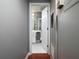 Hallway view of bathroom, with white vanity, white tile and modern fixtures, adding elegance and convenience at 3481 Lakeside Ne Dr # 1705, Atlanta, GA 30326