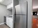 Modern kitchen with stainless steel refrigerator, white cabinets, granite countertops, and stainless steel dishwasher at 3481 Lakeside Ne Dr # 1705, Atlanta, GA 30326