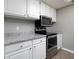 A well-lit kitchen with white cabinets, granite countertops, and stainless steel appliances at 3481 Lakeside Ne Dr # 1705, Atlanta, GA 30326