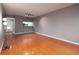 Open-concept living room with hardwood floors and track lighting at 3481 Lakeside Ne Dr # 1705, Atlanta, GA 30326