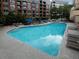 Community pool and lounge area for residents to enjoy the sun with patio furniture and a resort style pool at 3481 Lakeside Ne Dr # 1705, Atlanta, GA 30326