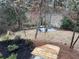 Backyard path leading to a firepit surrounded by natural landscaping and mature trees at 904 Kings Ne Ct, Atlanta, GA 30306