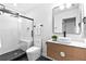 Stylish bathroom featuring a modern vanity, sleek fixtures, and a glass-enclosed shower with a bench at 904 Kings Ne Ct, Atlanta, GA 30306