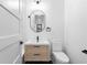 Bathroom showcasing a modern vanity, black hardware, and toilet at 904 Kings Ne Ct, Atlanta, GA 30306