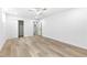 Spacious bedroom with hardwood flooring, ceiling fan, and a view to the stairway at 904 Kings Ne Ct, Atlanta, GA 30306