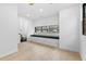 Sunlit bedroom with hardwood floors, built-in bench, and neighborhood views at 904 Kings Ne Ct, Atlanta, GA 30306