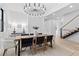 Dining room features a striking chandelier and staircase with wire railing at 904 Kings Ne Ct, Atlanta, GA 30306