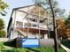 Modern two-story home with a spacious deck, outdoor seating, and a unique container pool at 904 Kings Ne Ct, Atlanta, GA 30306