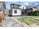 Two-story home with modern design, landscaped yard, and contemporary driveway at 904 Kings Ne Ct, Atlanta, GA 30306