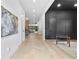 Bright hallway with herringbone floors leads to an open living space with natural light and stylish decor at 904 Kings Ne Ct, Atlanta, GA 30306