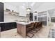 Open kitchen with a large central island, pendant lighting, and stainless steel appliances at 904 Kings Ne Ct, Atlanta, GA 30306