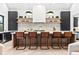 Modern kitchen featuring a large island with bar seating, stainless steel appliances, and stylish lighting at 904 Kings Ne Ct, Atlanta, GA 30306