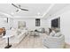 Spacious living room featuring neutral tones, a ceiling fan, and access to the outdoors at 904 Kings Ne Ct, Atlanta, GA 30306