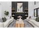 Bright living room featuring a modern fireplace, custom shelving, and stylish decor at 904 Kings Ne Ct, Atlanta, GA 30306