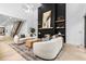 Spacious living room with a sleek fireplace, high ceilings, and an open staircase at 904 Kings Ne Ct, Atlanta, GA 30306