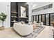 Inviting living room boasting a fireplace, access to an outdoor deck, and bright natural light at 904 Kings Ne Ct, Atlanta, GA 30306