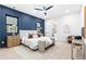 Luxurious main bedroom features a statement wall and access to the ensuite bath at 904 Kings Ne Ct, Atlanta, GA 30306