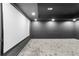 Basement movie room with a large screen, dark walls, recessed lighting, and gray carpet at 904 Kings Ne Ct, Atlanta, GA 30306
