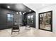 Stylish home office with ample natural light, custom dark paneling, and sleek modern furniture at 904 Kings Ne Ct, Atlanta, GA 30306