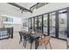 Relax and dine on this covered patio with an outdoor table and great view of the trees at 904 Kings Ne Ct, Atlanta, GA 30306