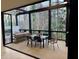 Covered patio features wood flooring and railing overlooking wooded backyard at 904 Kings Ne Ct, Atlanta, GA 30306