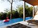 Stunning pool with a flamingo float, surrounded by lush greenery and a relaxing lounge area at 904 Kings Ne Ct, Atlanta, GA 30306
