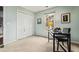 This room features neutral walls, a closet, a window, and light-colored carpeting at 1605 Loblolly Ln, Cumming, GA 30041